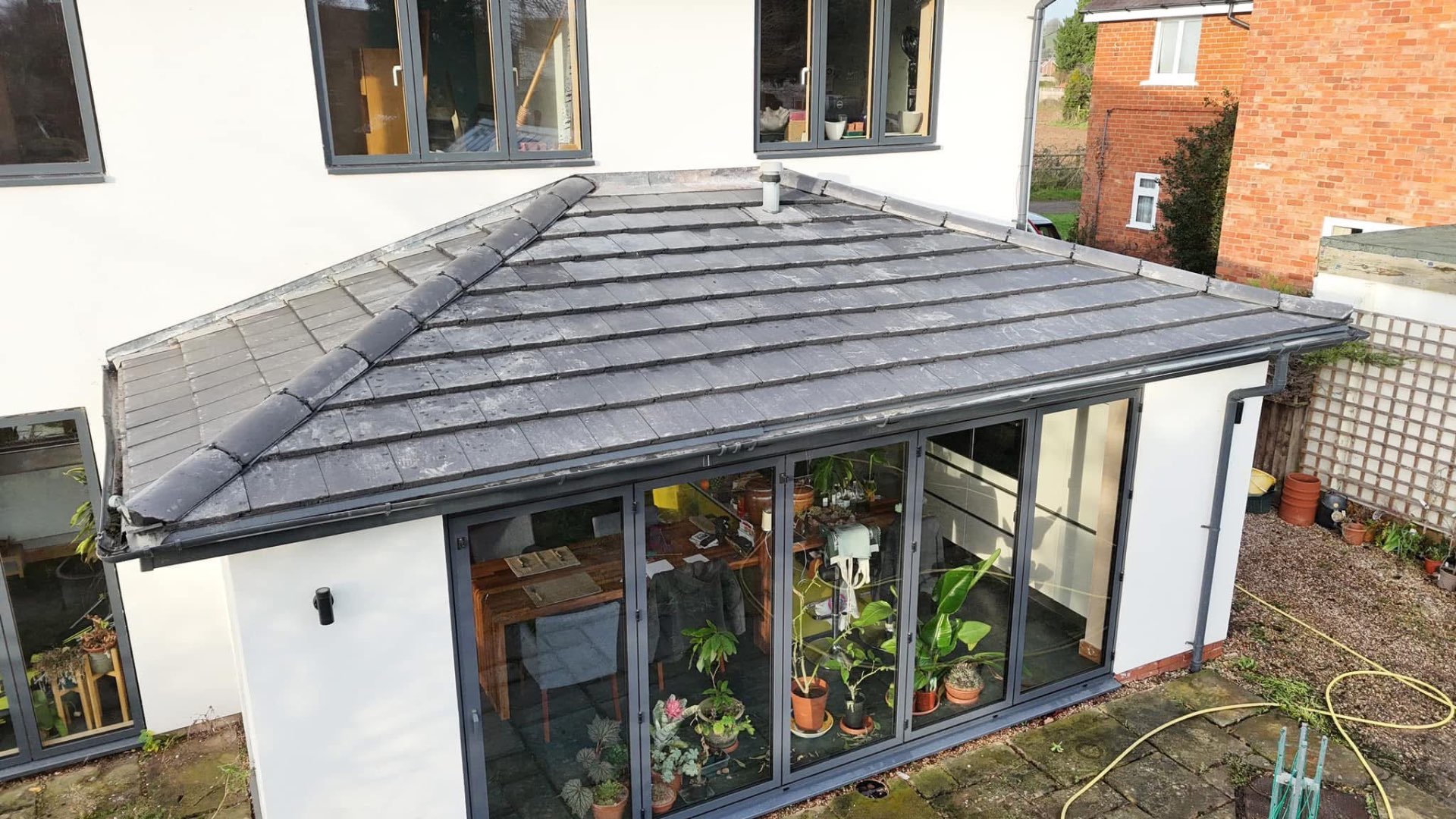 Completed tiled extension roof by RedLand Roofing Services